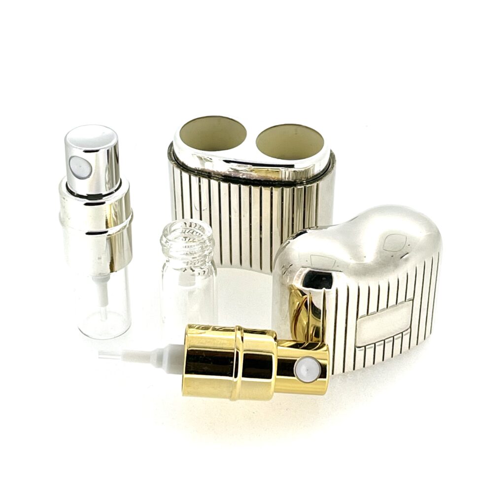 Atomiser with lid removed to show dual spray design