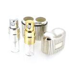 Silver and gold-tone spray nozzles from vintage perfume atomiser