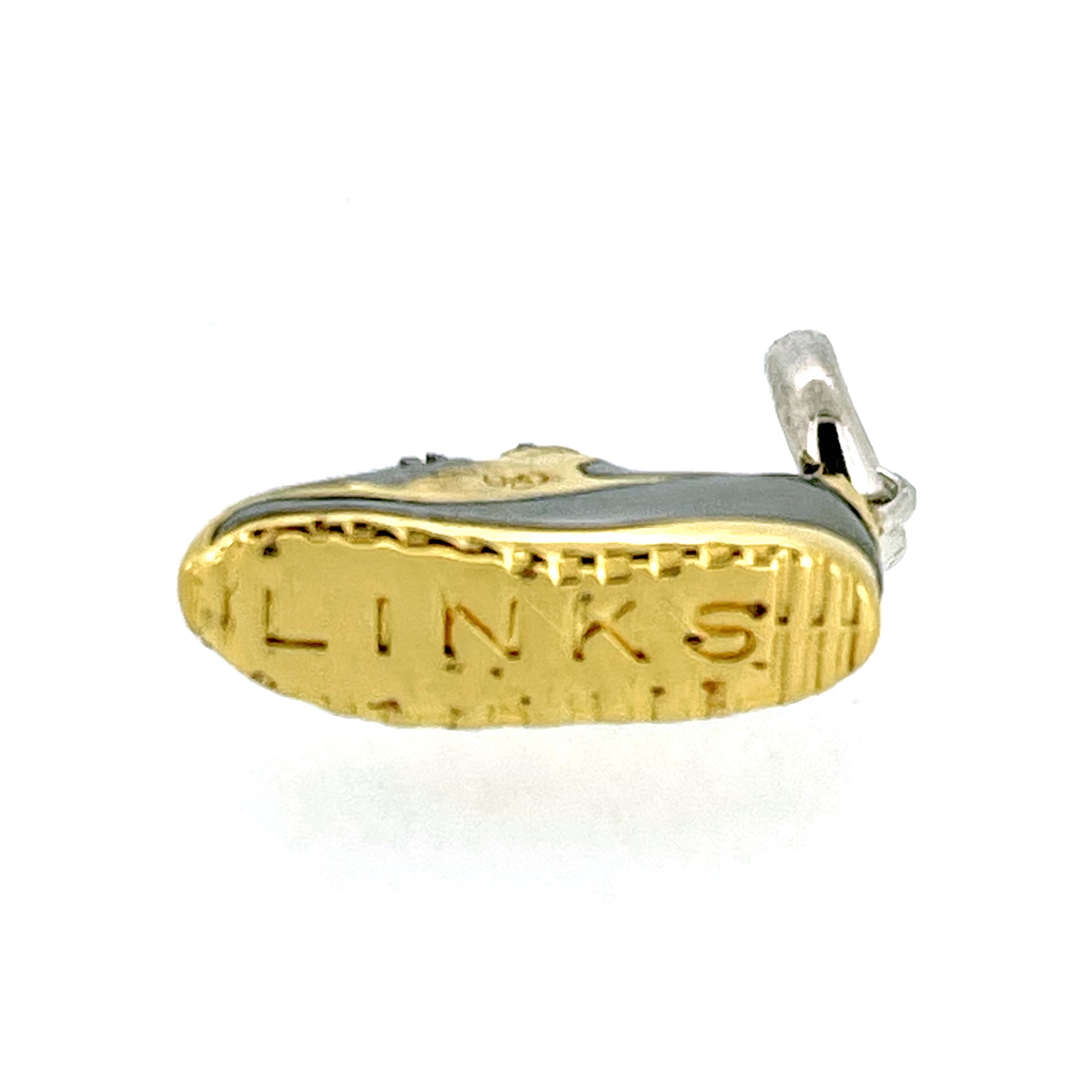 Bottom of charm showing ‘LINKS’ engraving on sole