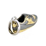 Detailed close-up of gold vermeil accents on trainer heel