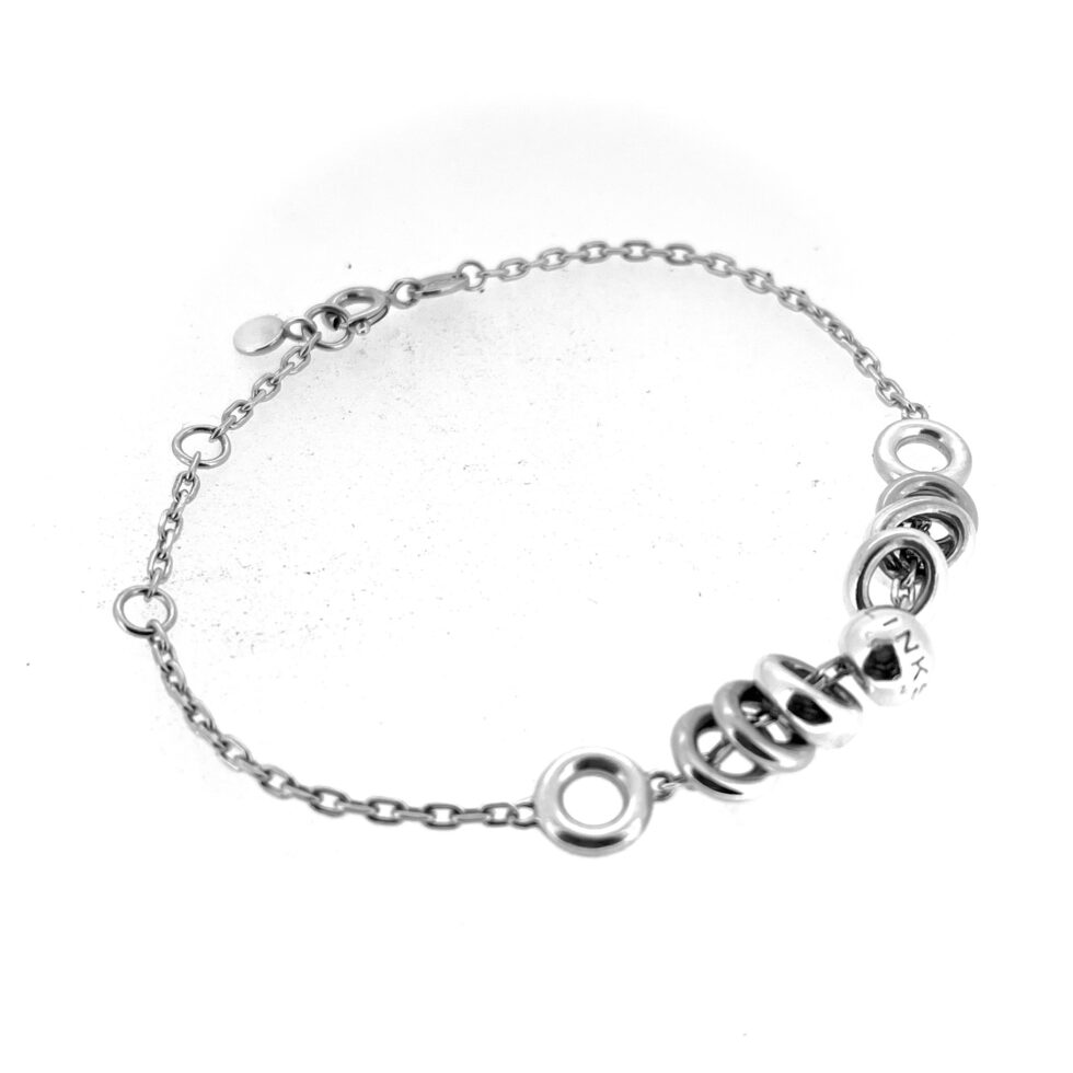 Close-up of Sweetie ring cluster on chain