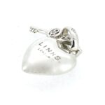 Side view of heart and key charm.