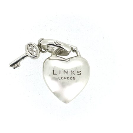 Close-up of engraved Links London heart and key charm.