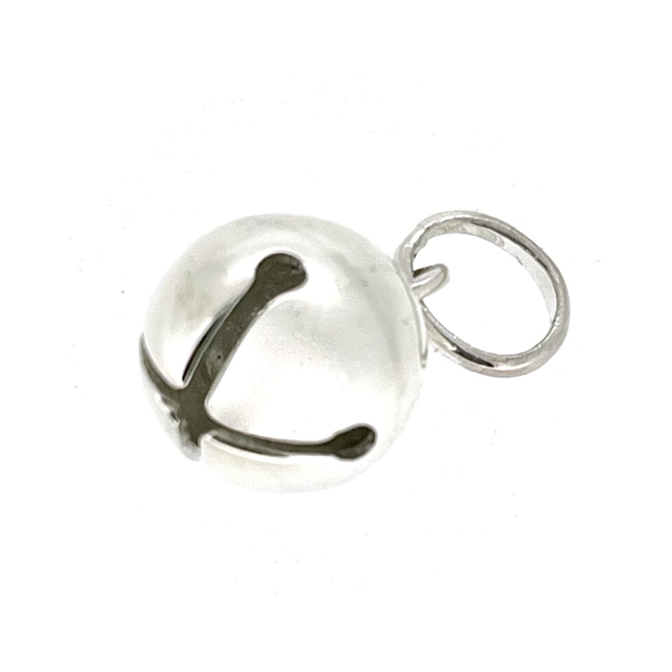Sleigh Bell Charm photographed on white background