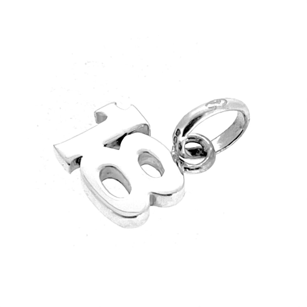 Silver “18” charm polished and cleaned