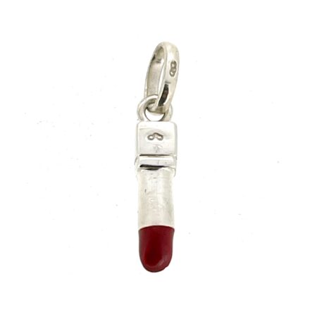 Front view of vintage lipstick charm on neutral background