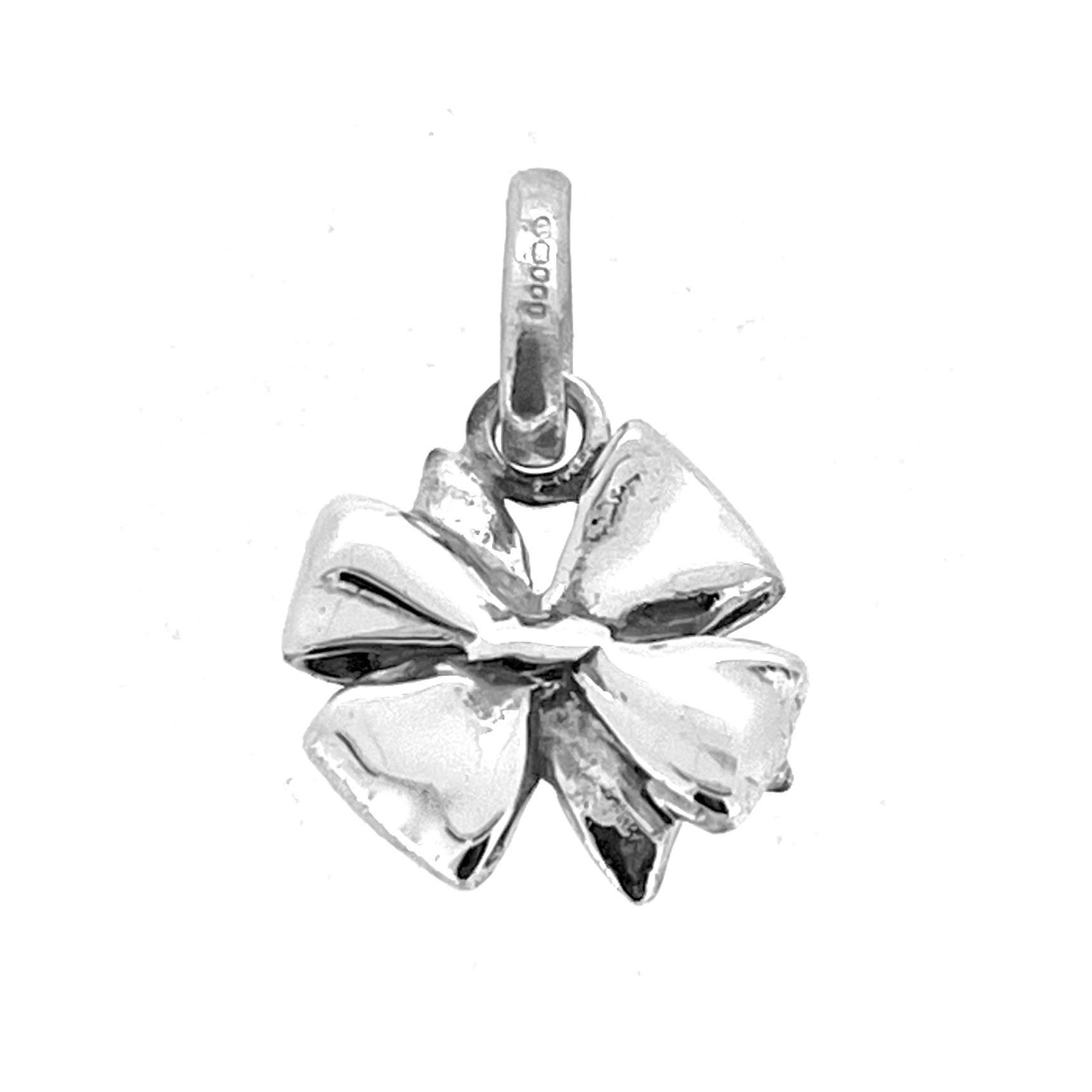 Three-dimensional silver bow charm photographed flat