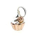 Charm shaped like a cupcake with frosting detail