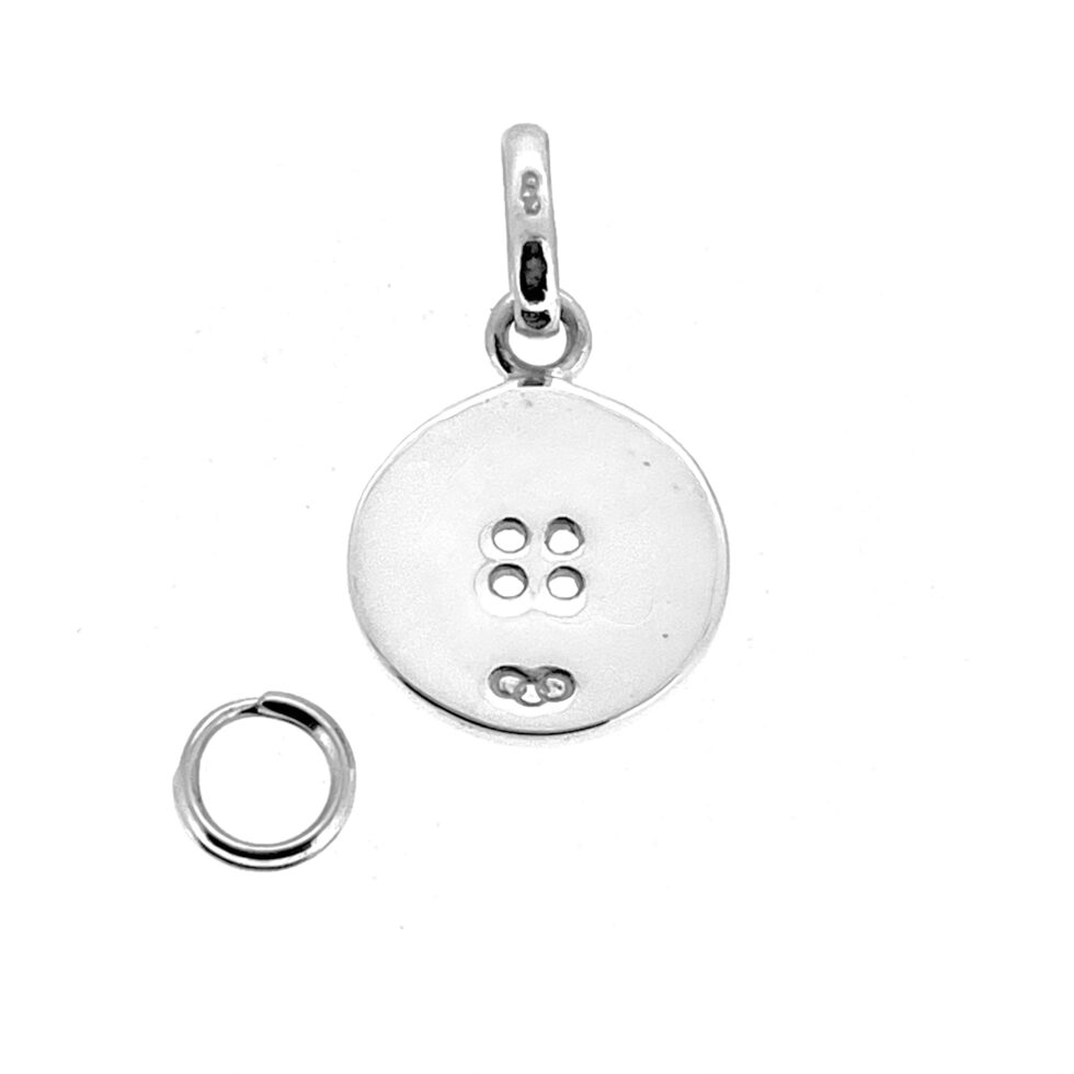 Macro close-up vintage Four Hole Button Charm in silver finish