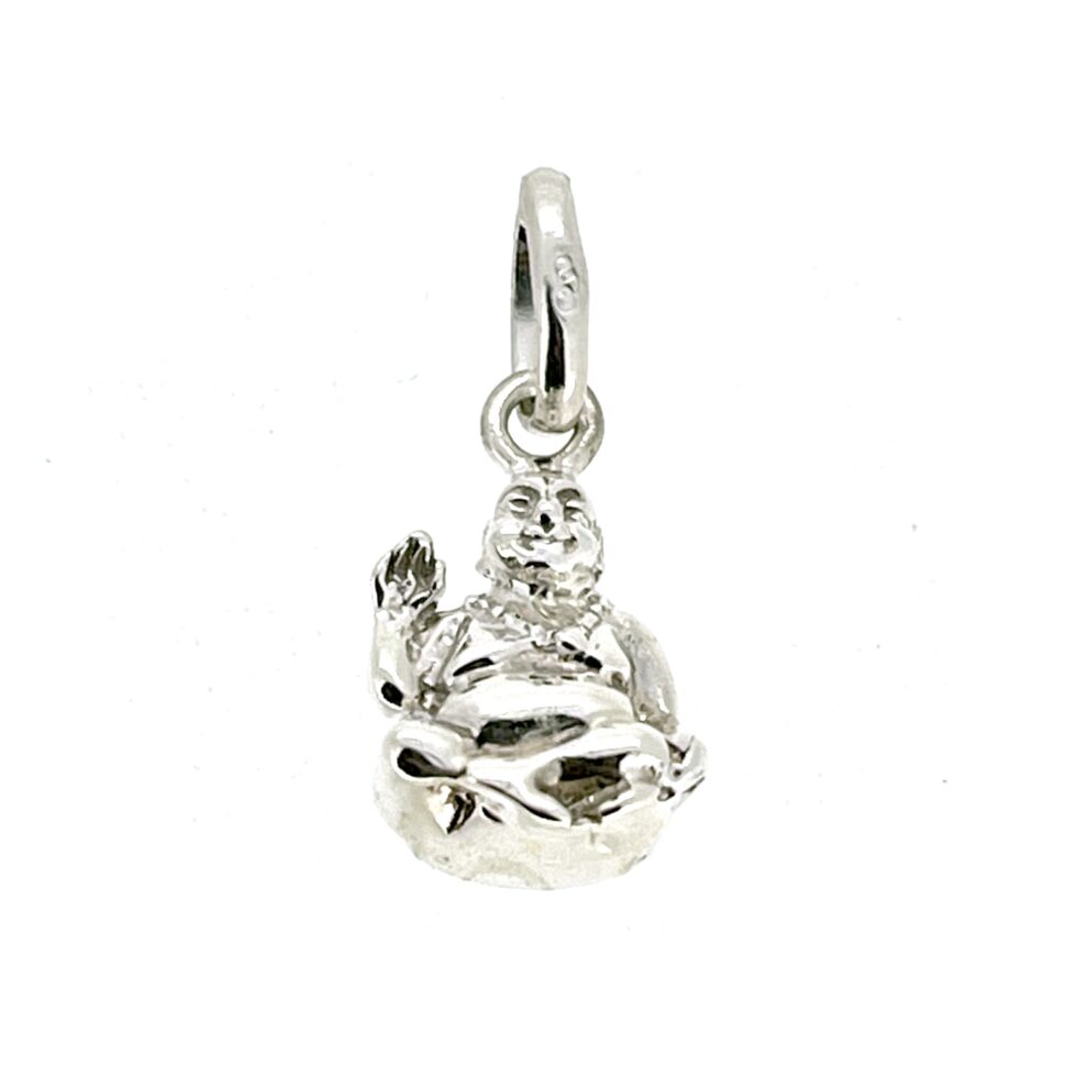 Vintage Buddha charm on neutral background