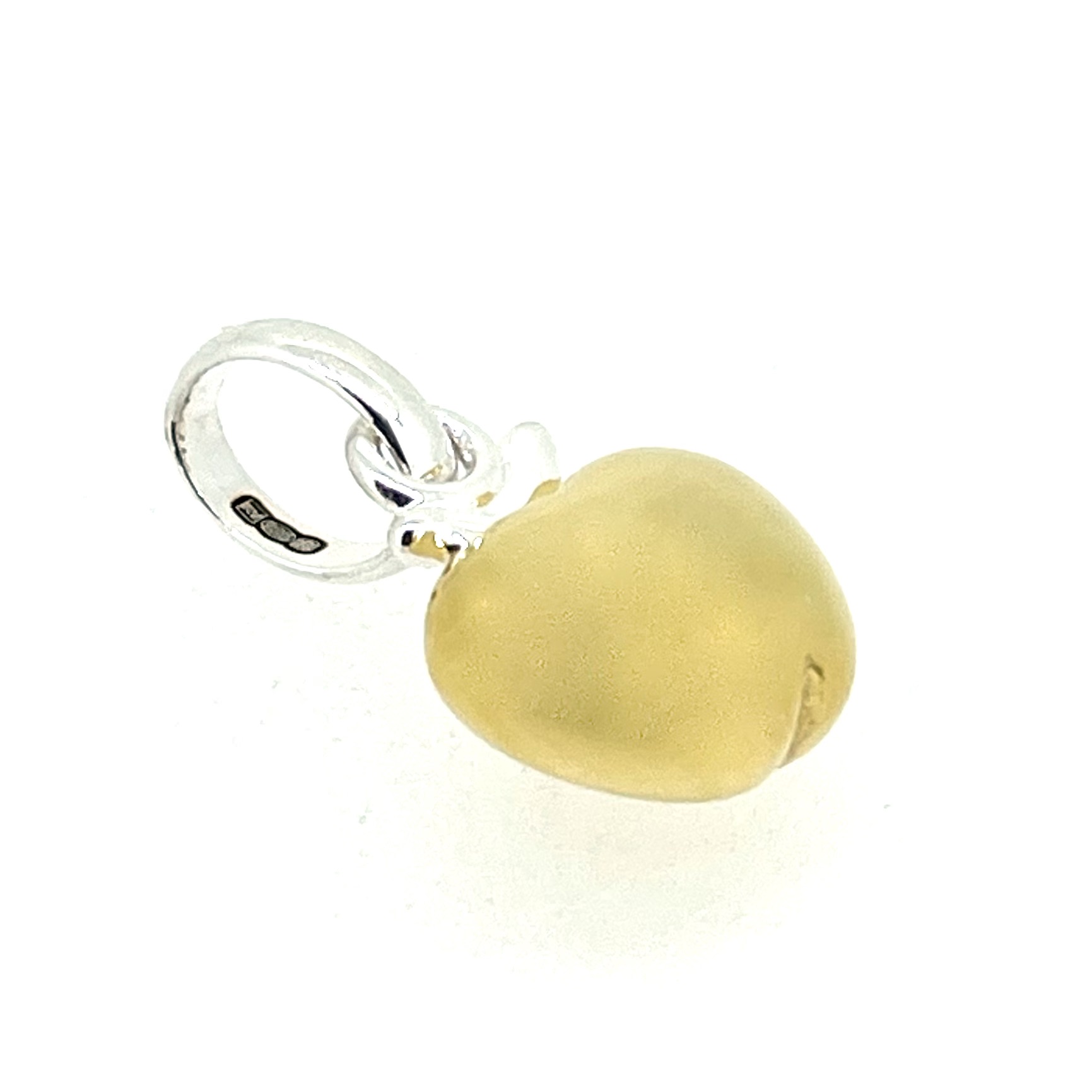 Charm styled on a plain background for close-up detail
