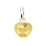 Close-up of the “I ❤️ NYC” engraving on gold charm