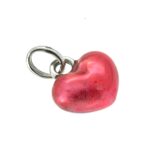 Side view of red enamel Mini Heart Charm on white background