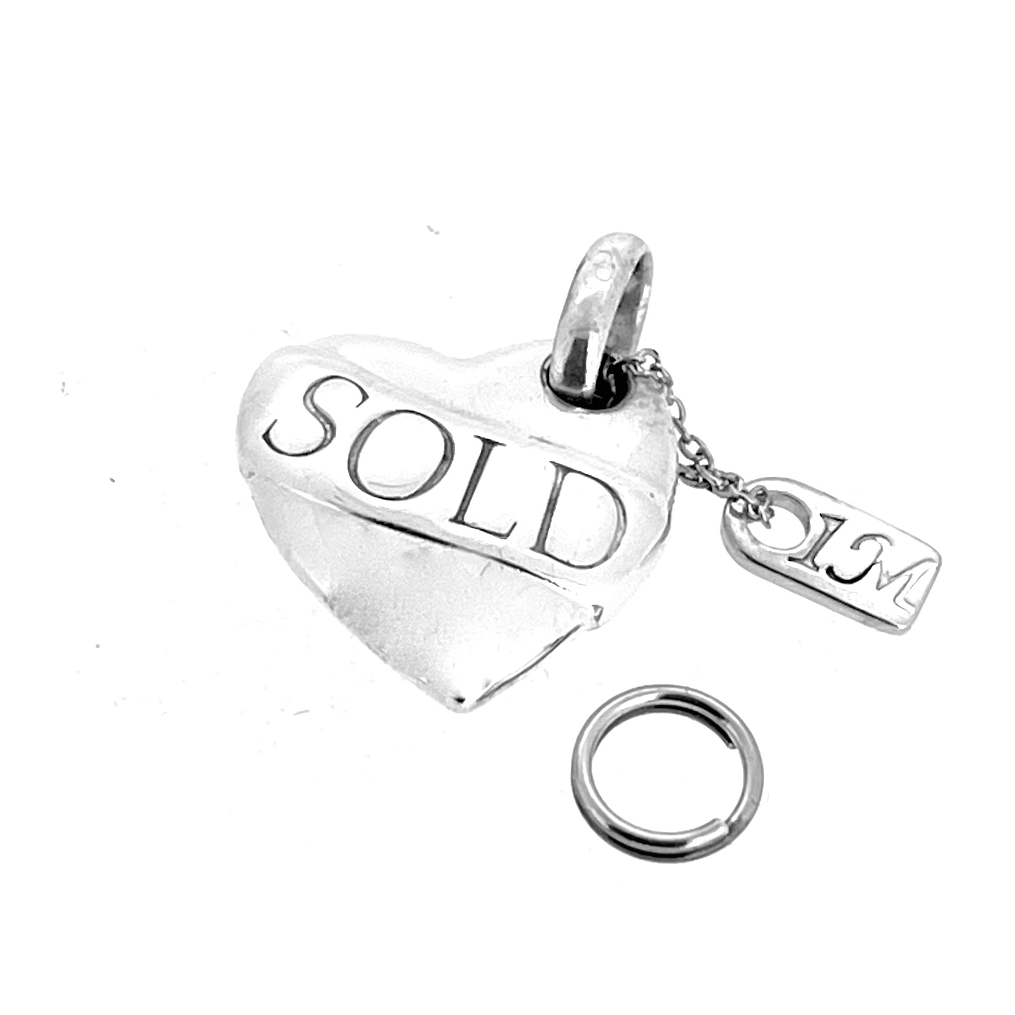 Vintage 2010 heart charm with polished sterling silver finish