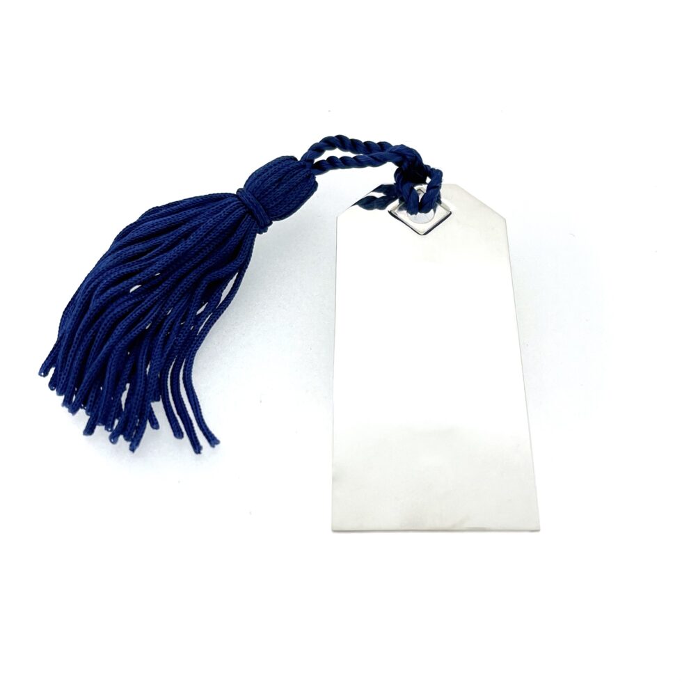 Sterling silver bookmark shaped like a luggage tag with angled corners