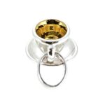 Charm featuring teacup and saucer in silver and gold