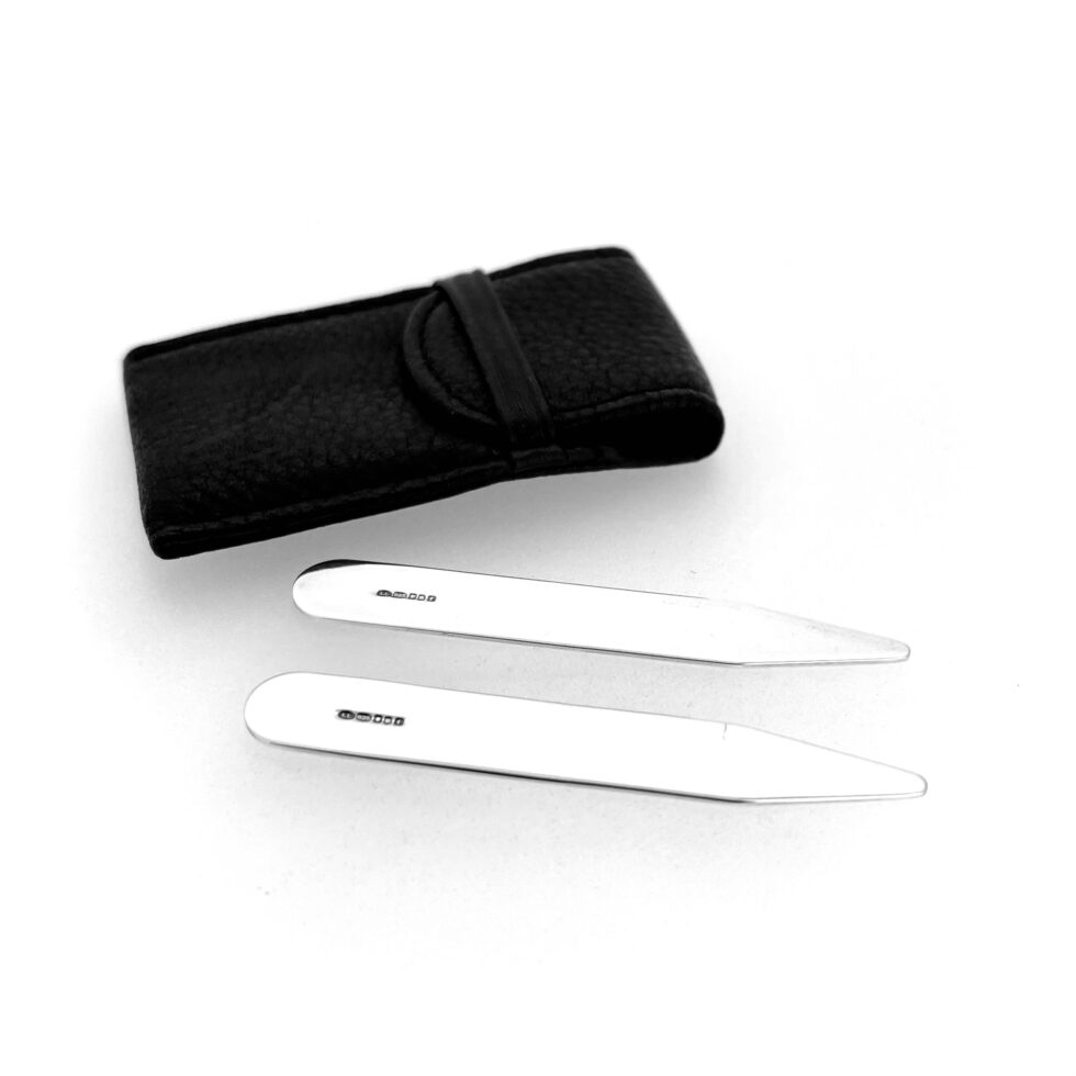 Sterling silver collar stiffeners displayed beside original packaging