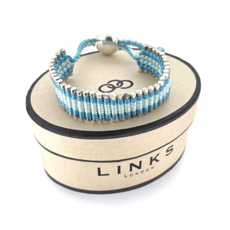 Oval box with Links of London Logo branding and vintage friendship bracelet