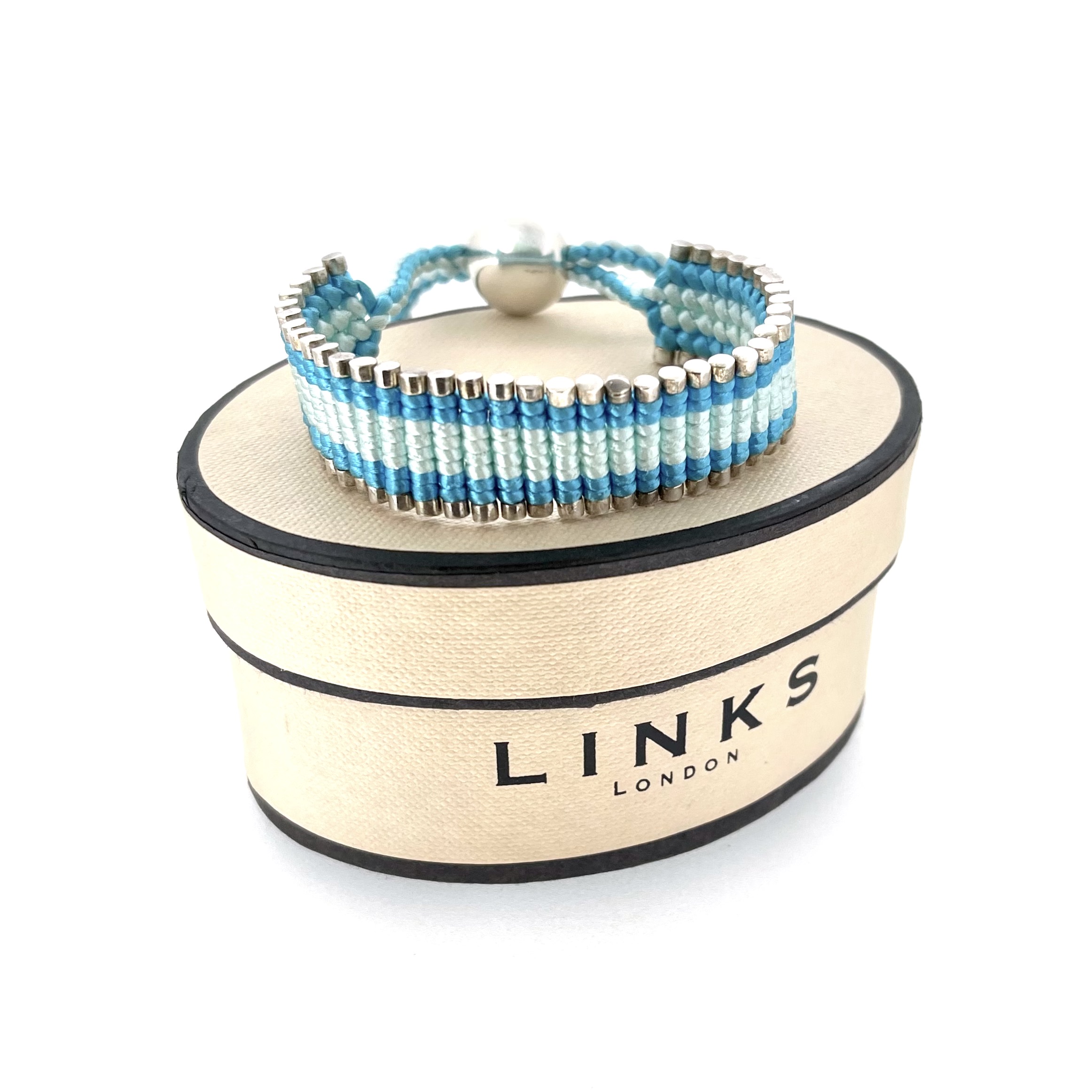 Oval box with Links of London branding and vintage bracelet