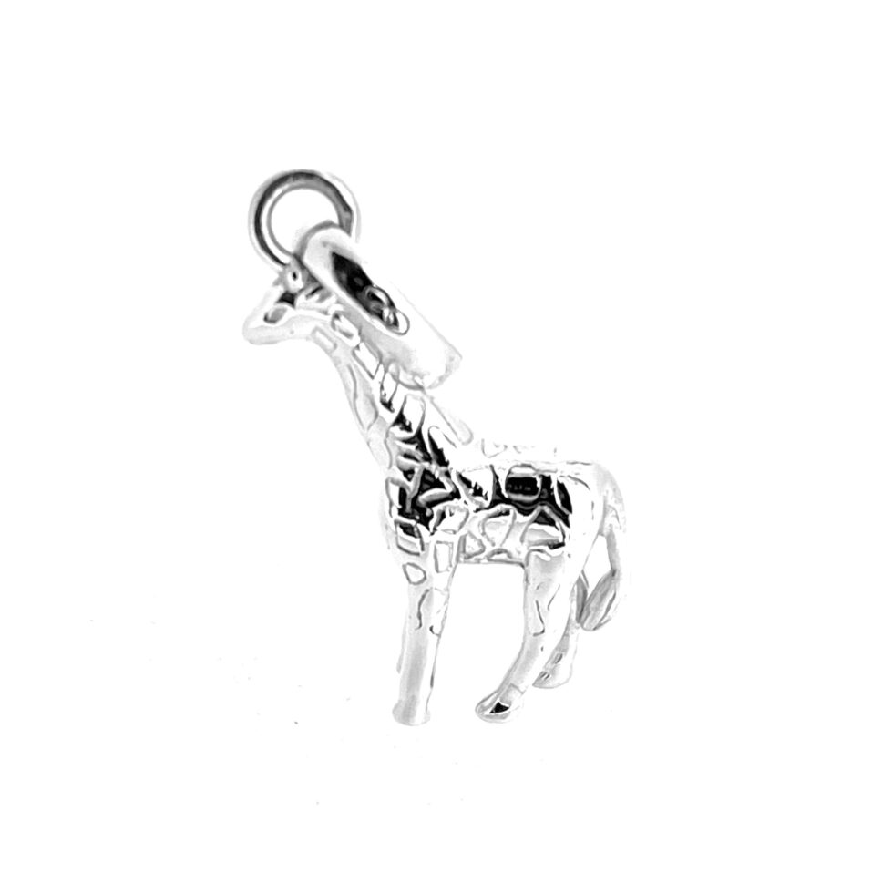 Polished vintage giraffe charm photographed against white background