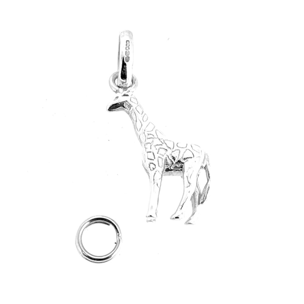 Polished vintage giraffe charm photographed against white background