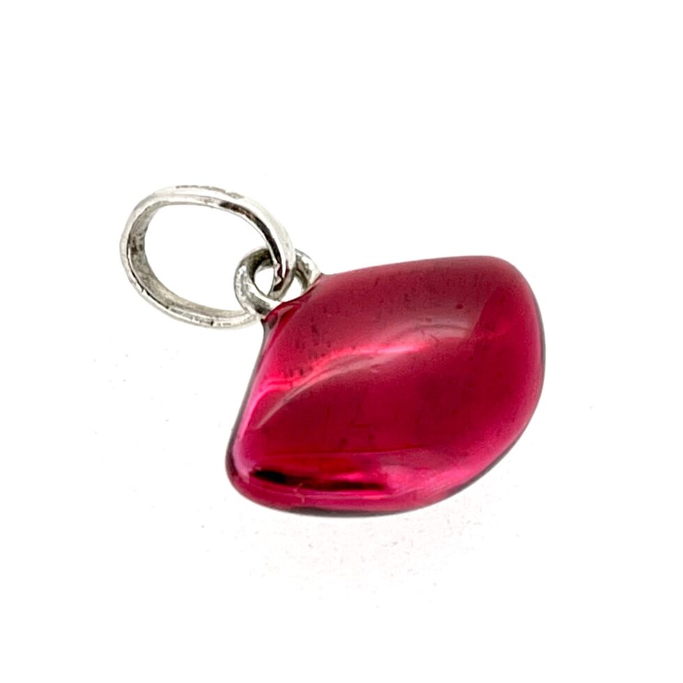 Vintage lips charm photographed under bright lighting