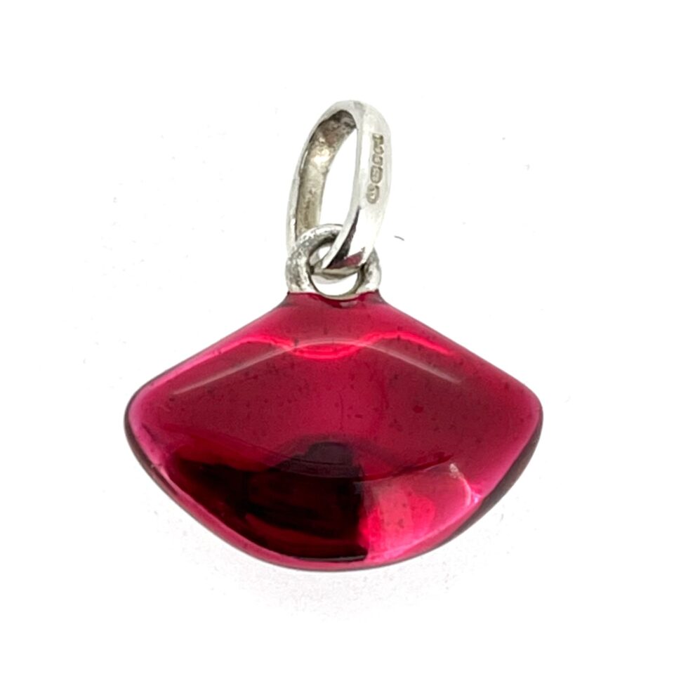 Sterling silver lips charm with translucent enamel photographed flat lay