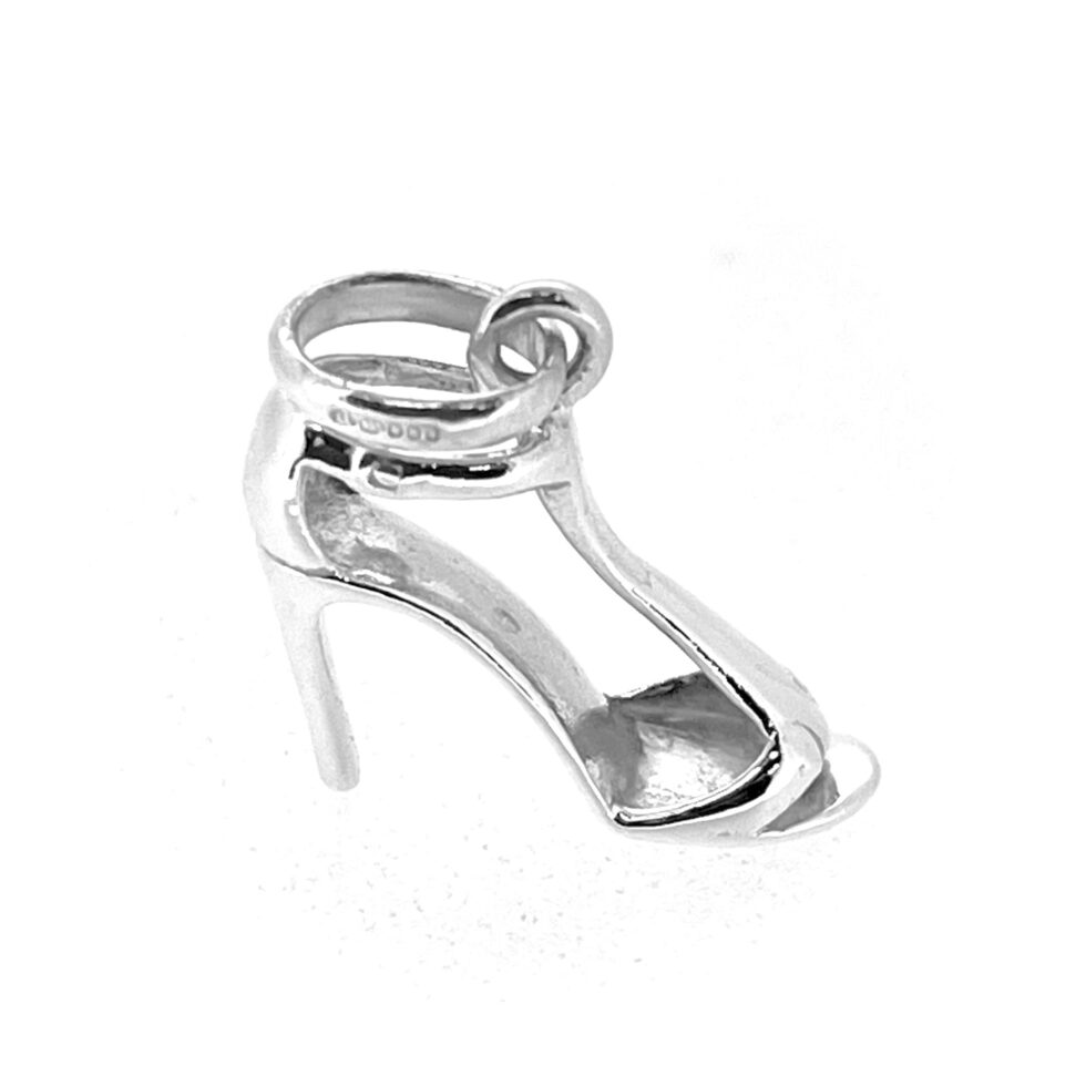 Close-up of sterling silver stiletto shoe charm showing T-strap design