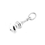Side view of sterling silver dome charm showing polished surface.