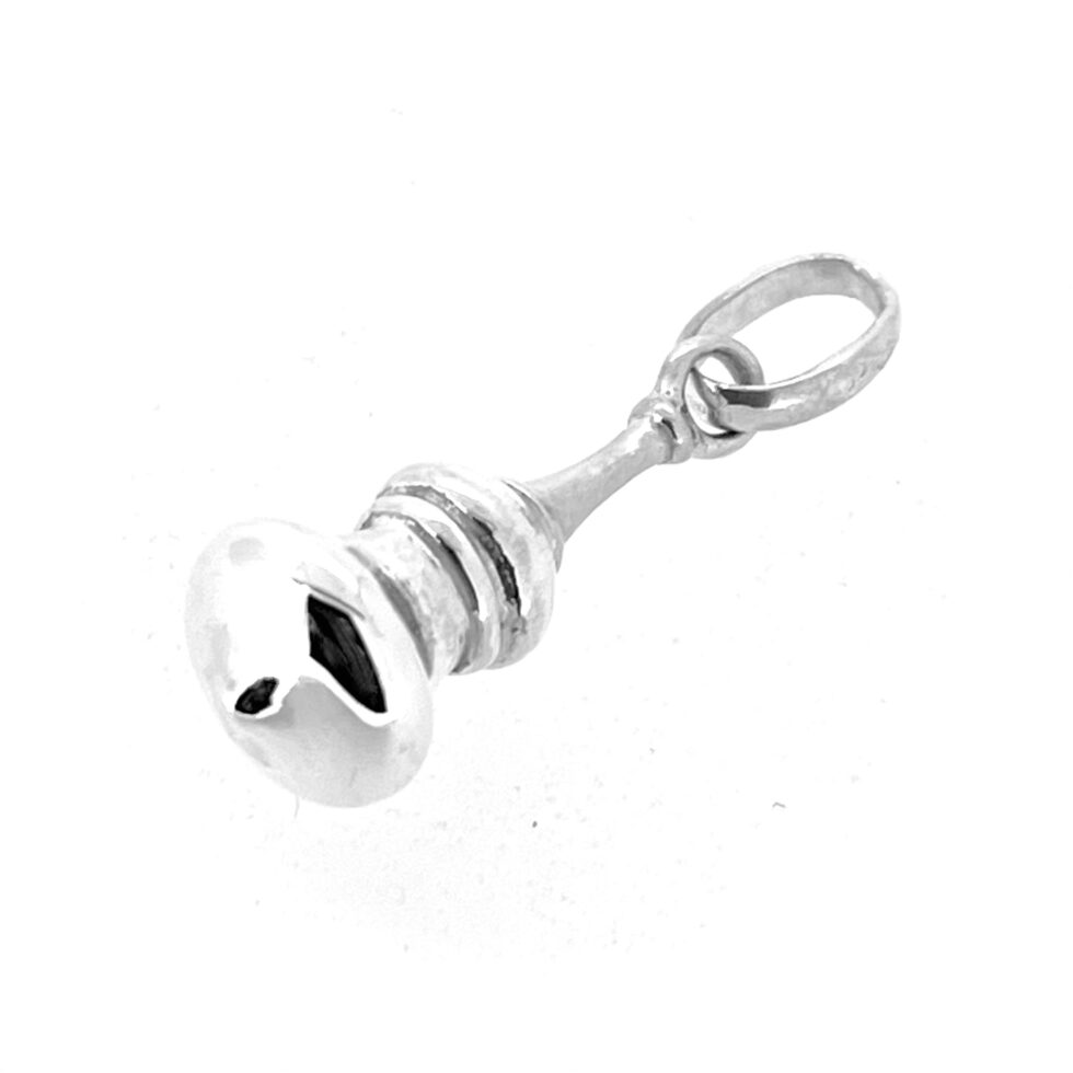 Polished silver dome charm reflecting light on curved surface.