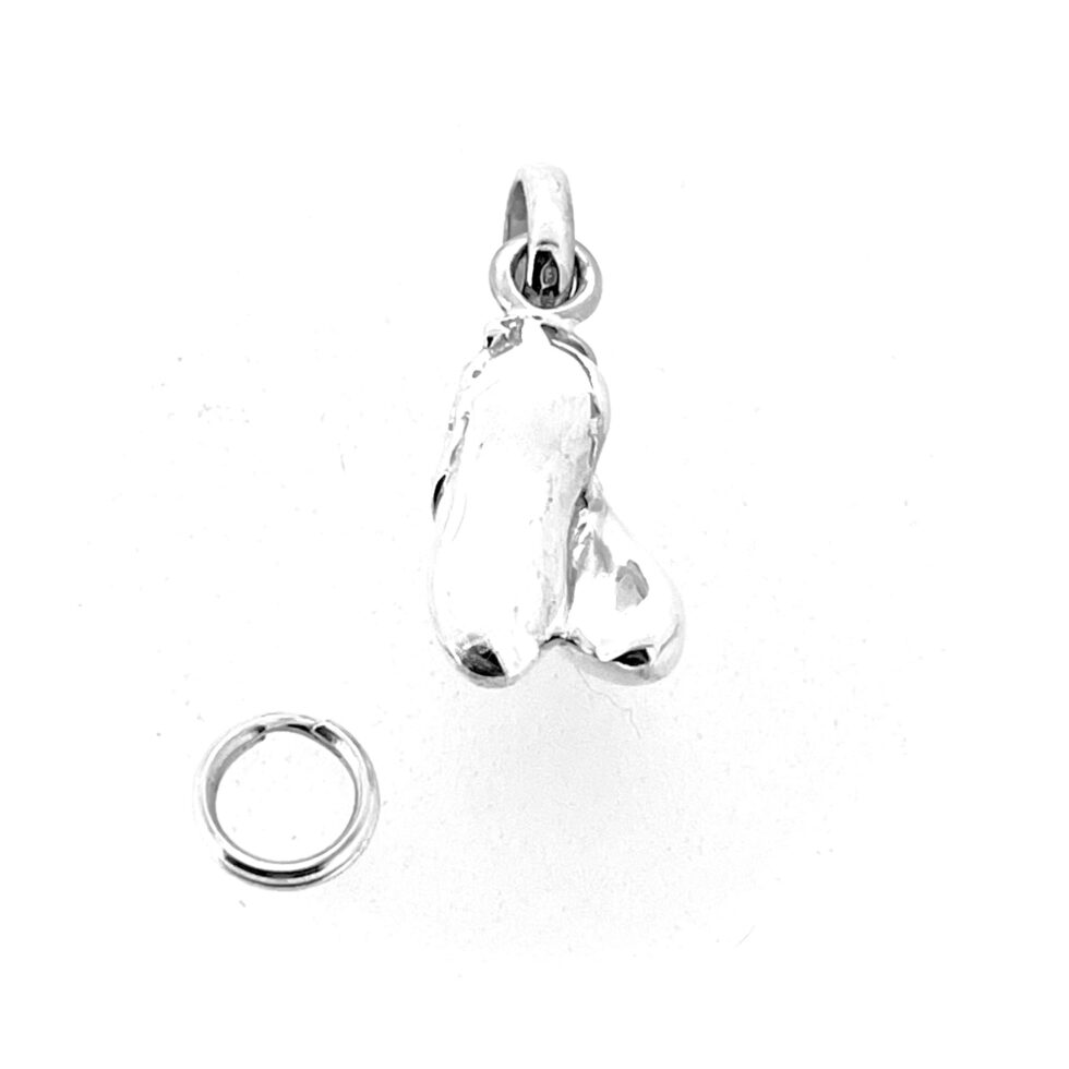 Perspective view of ballet shoes charm polished in silver.