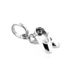 Detail of miniature ballet shoes charm polished finish.