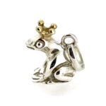 Charm detail showing frog’s eye and crown craftsmanship