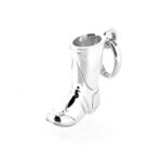 Polished sterling silver boot charm reflecting light.