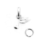 Vintage music charm with symbolic wing detail.