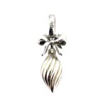 Close-up of twisted silver bauble with gold vermeil detail.