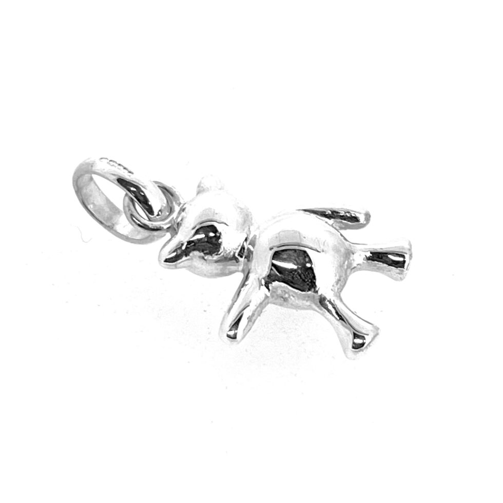 Red heart bear charm photographed on white background