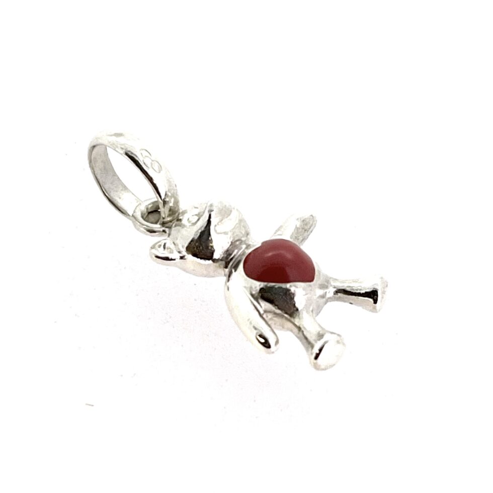 Close-up of red enamel heart on silver bear charm