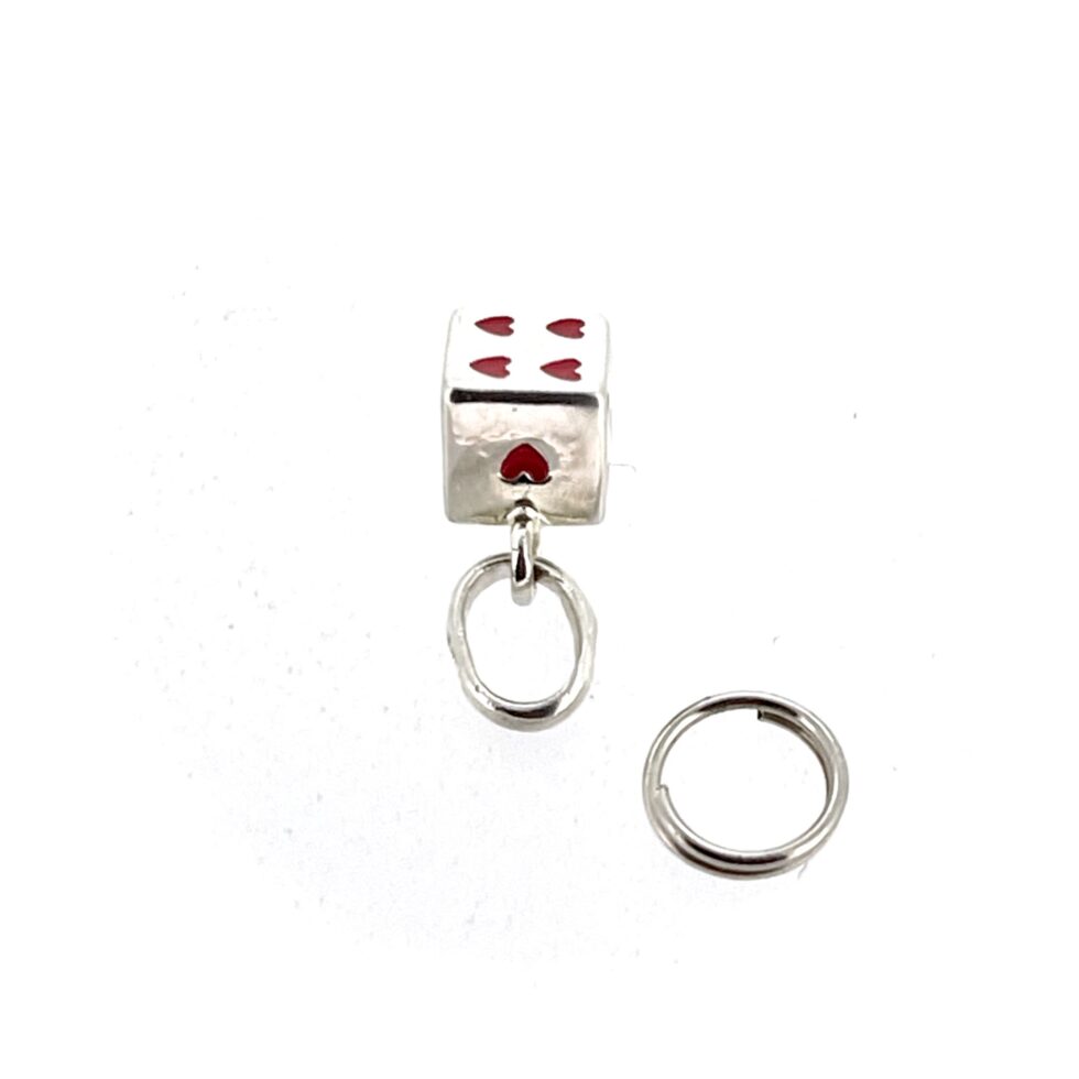 Charm photographed on white background with bail detail