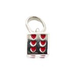 Small cube charm with red hearts in place of numbers