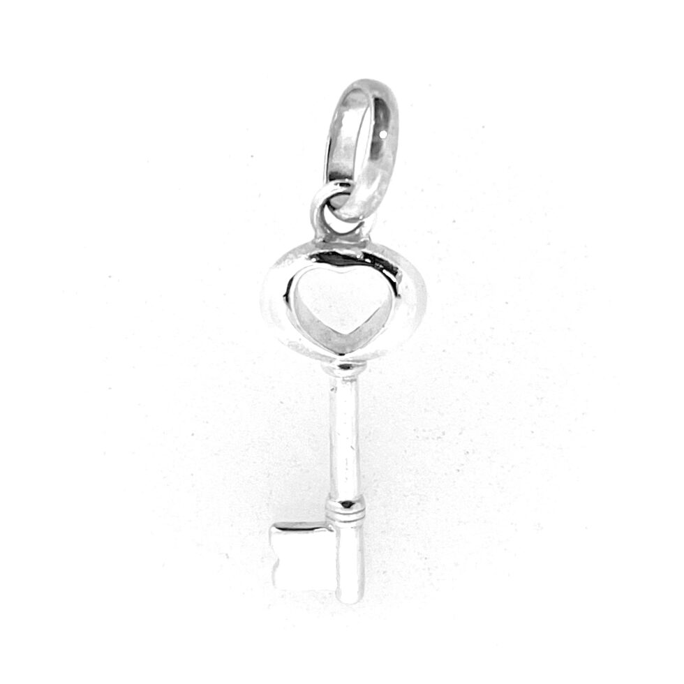 Vintage Links charm photographed on white background