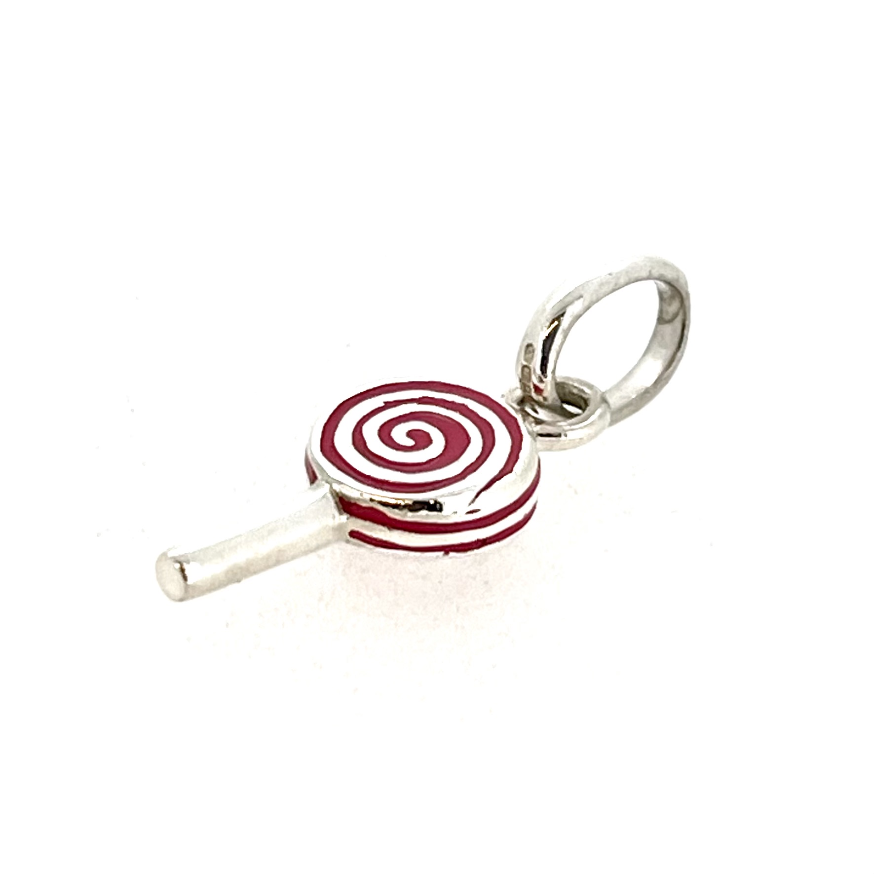 Macro of red enamel lines revealing silver between swirls