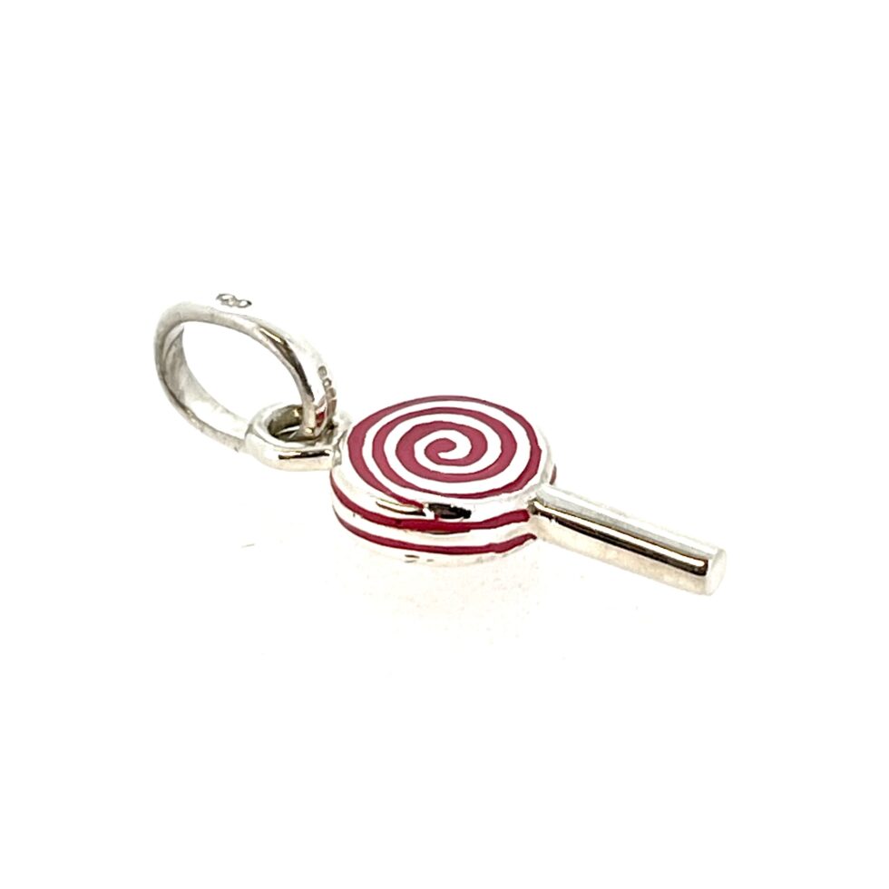 Red enamel swirl on polished sterling silver close-up