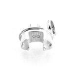 Underside of Links of London pedestal desk charm featuring three-ring logo.