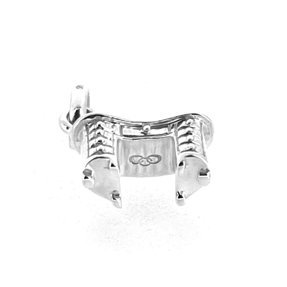 Underside of Links of London pedestal desk charm featuring three-ring logo.