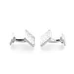 Textured silver cufflink face with organic reticulation pattern
