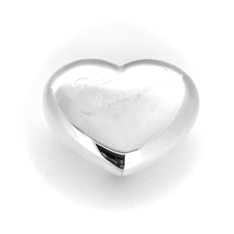 Macro detail of Please Marry Me engraving