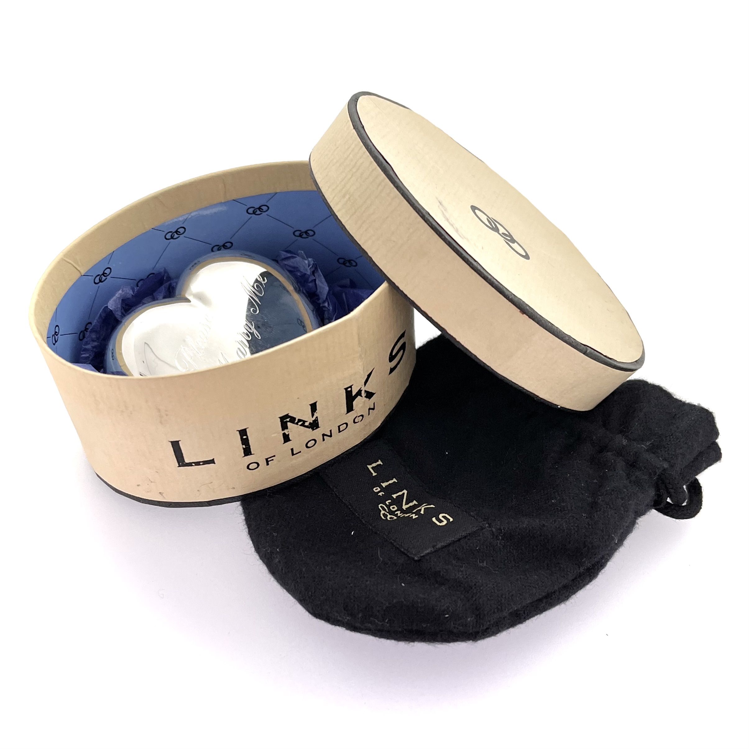 Paperweight resting in box with visible blue interior