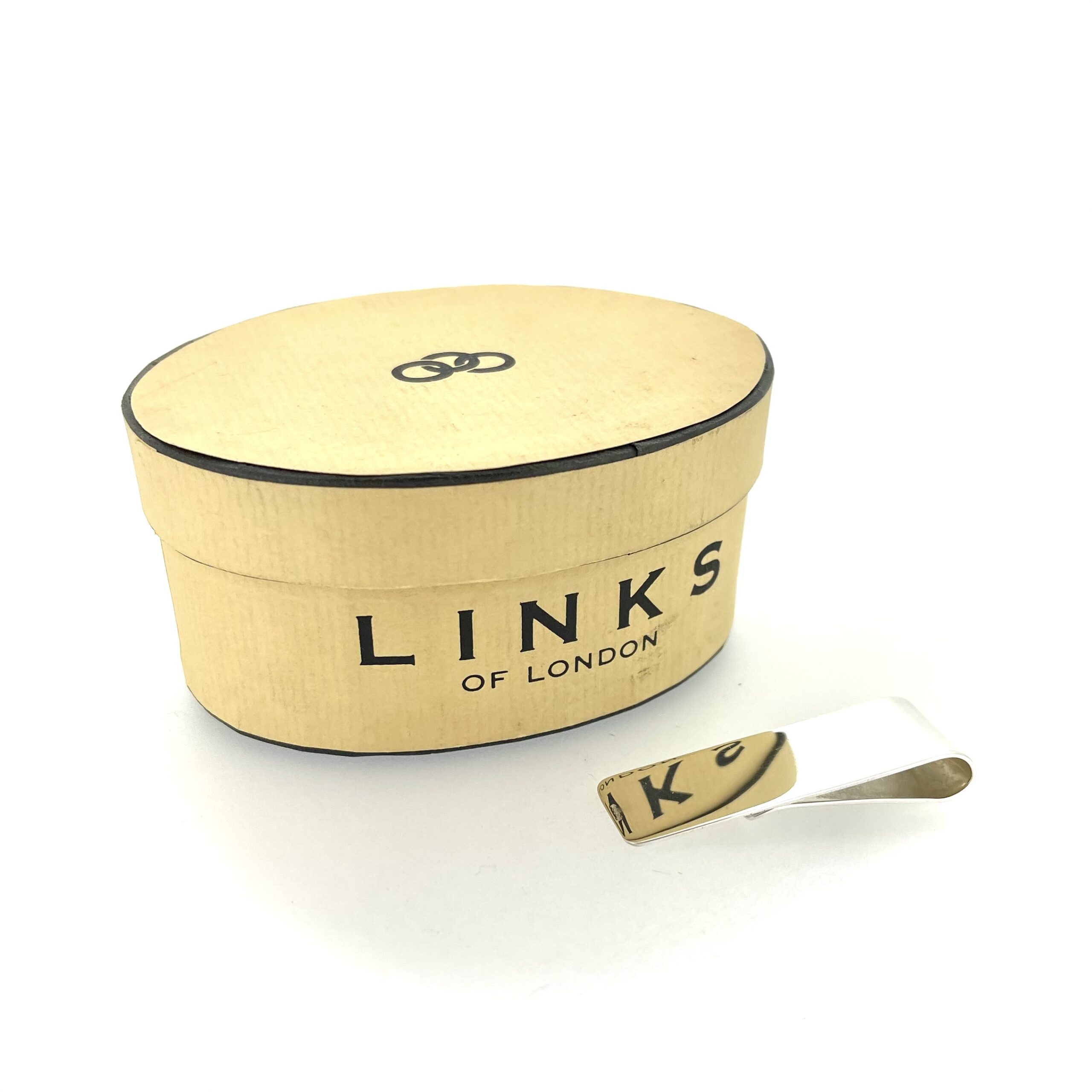 Restored vintage money clip reflecting light close-up