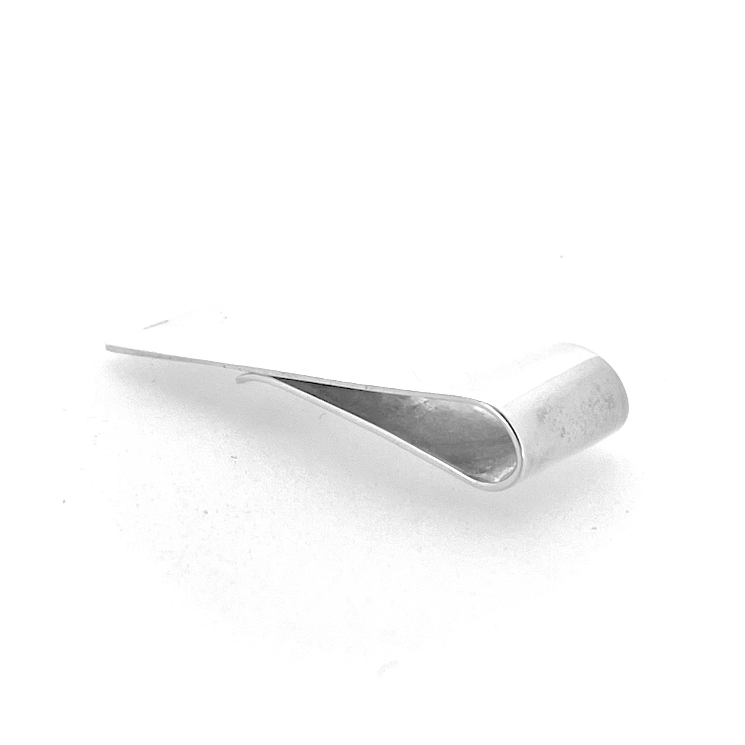 Refurbished money clip showing mirror finish and light marks